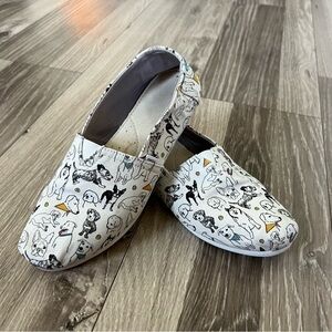 Toms, size 7.5, dog print, off-white background. 
Pre-owned